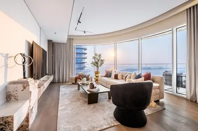 a living room with a couch and a table at Luxurious Bliss - 3-BR plus maids - Grand Bleu by Elie Saab in Dubai