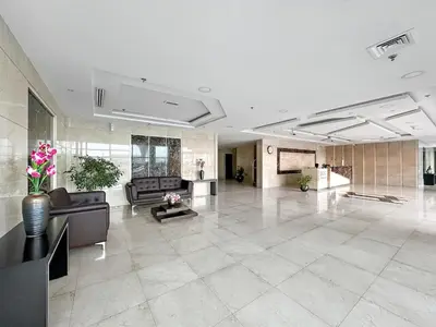 a large lobby with couches and tables in a building at Cozy Apartment in Central Dubai Marina near Beach in Dubai