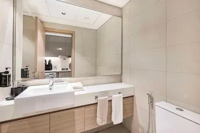 a bathroom with a sink and a mirror at Daniels Studio at Meydan with Community View in Dubai