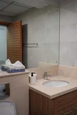 a bathroom with a sink and a mirror at Marjan Escape Studio in Dubai