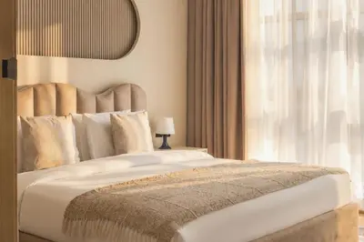 a bedroom with a large bed and a window at Fountain & Opera Views 1 Bedroom Apartment with Balcony in Dubai