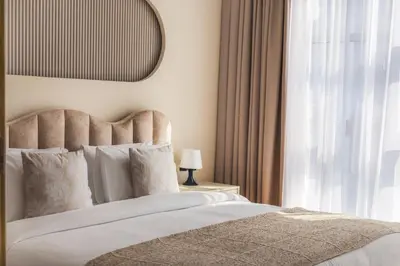 a bedroom with a large bed and a window at Fountain & Opera Views 1 Bedroom Apartment with Balcony in Dubai