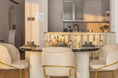 a dining room with a table and chairs at Fountain & Opera Views 1 Bedroom Apartment with Balcony in Dubai