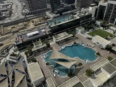 an overhead view of a swimming pool in a city at Luxury 1-Bedroom Apartment with Pool Access in DIFC, Dubai in Dubai