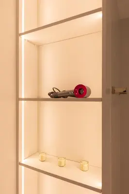 a pair of scissors on a shelf with candles at Spacious 2BR in Sulafa Tower - Dubai Marina in Dubai