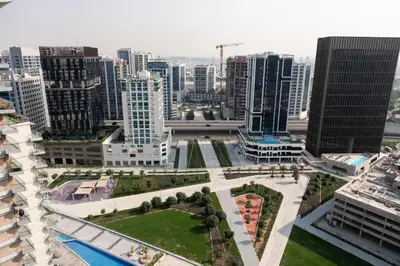 an aerial view of a city with tall buildings at Modern Studio with Balcony, Stunning City Views & Free Parking, Close to Dubai Mall in Dubai
