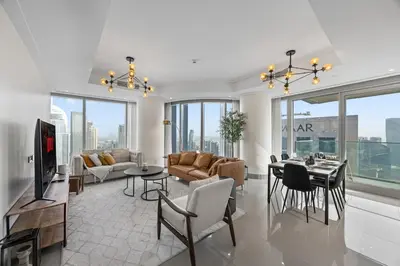 a living room with a couch and a table at 2BR at Opera Grand, Fountain and Burj Khalifa Views in Dubai