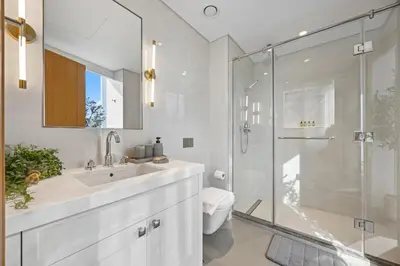 a bathroom with a toilet and a sink and a shower at 2BR at Opera Grand, Fountain and Burj Khalifa Views in Dubai