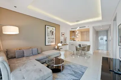 a living room with a couch and a table at High-Rise Living - Paramount Tower - 1 bedroom in Dubai