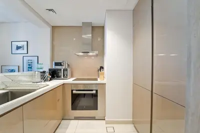 a kitchen with a sink and a counter top at High-Rise Living - Paramount Tower - 1 bedroom in Dubai
