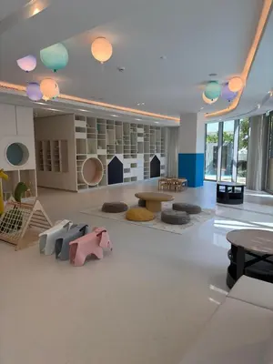 a large room with a room with tables and chairs at Elegant High-Rise Escape with sea view by SoleaStay in Dubai