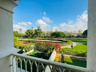 a view of a park from a balcony at The Springs 8 - 2 Bedroom with Maids Room Villa - Allsopp & Allsopp in Dubai