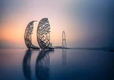 a group of three metal structures sitting on top of water at Stylish Urban Stay in Address JBR with Canal View in Dubai