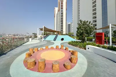 a skate park with a skateboard ramp and wooden logs at PVH - Modern 1BR with Golf Course View - Golf Gate in Dubai