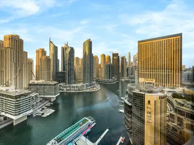 a view of a city with a river and buildings at Livora Stays - Marina Promenade , Walk to JBR in Dubai