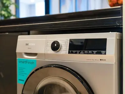 a washing machine sitting next to a microwave at Livora Stays - Marina Promenade , Walk to JBR in Dubai