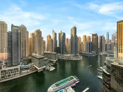 a view of a river in a city with buildings at Livora Stays - Marina Promenade , Walk to JBR in Dubai