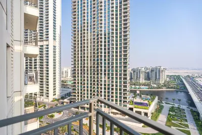 a view from the balcony of a large building at Apartment with Stunning Canal Views, Just Minutes from Dubai Mall and Burj Khalifa - 17 Icon Bay, Dubai Creek Harbour by Deluxe Holiday Homes in Dubai