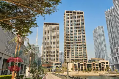 a group of tall buildings in a city at Brand New with Burj Khalifa View in Dubai