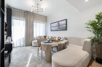 a living room with a couch and a table at Deluxe Binghatti Suites by Hostiva - Burj View in Dubai