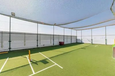 a tennis court with a net on top of it at Limited Time l Private Pool I Elegance l Prime Location in Dubai