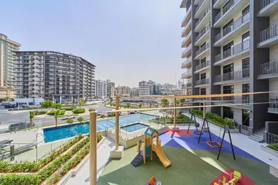 an apartment patio with a slide and a playground at Bright Studio Retreat in Floarea Residence Arjan in Dubai