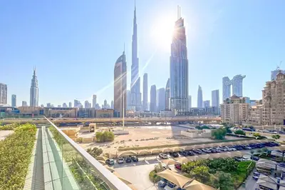 a view of a city skyline with tall buildings at Modern 1BR Near Dubai Mall in Downtown Views II in Dubai