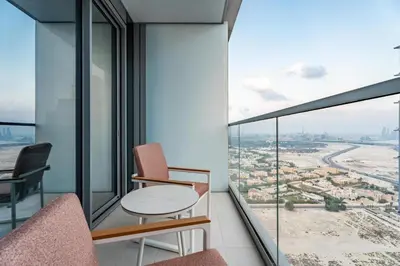 a room with a table and chairs and a view at GuestReady - 1BR Near Dubai Mall | Downtown Stay in Dubai