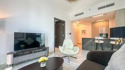 a living room with a large flat screen tv at Modern & Cozy 1BR in Business Bay with Pool View - 10AB05 in Dubai