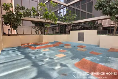 an image of a building with a painting on the floor at Cozy 1BR in Belgravia , JVC, Pool View, 20 Min from Downtown Dubai in Dubai