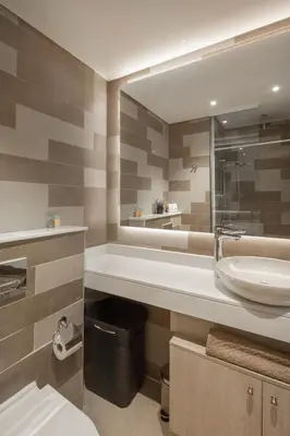 a bathroom with a sink and a mirror at Elegant One-Bedroom Sea View Retreat on Palm West in Dubai