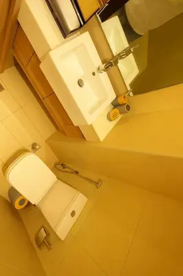 an overhead view of a bathroom with a toilet and sink at Azizi in Dubai