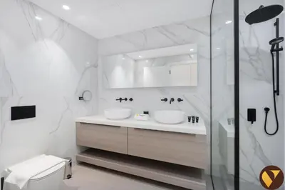 a white bathroom with two sinks and a shower at Vogue Emirates Hills, Vida The Hills Residence near Marina and JBR, Three Bedroom Apartment with Balcony and Golf Club View, Access to all Amenities in Dubai