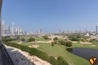 a golf course with a city in the background at Vogue Emirates Hills, Vida The Hills Residence near Marina and JBR, Three Bedroom Apartment with Balcony and Golf Club View, Access to all Amenities in Dubai