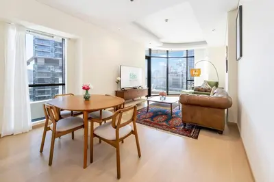 a living room with a table and a couch at Urban 1BR Retreat RP Heights Near Dubai Mall in Dubai