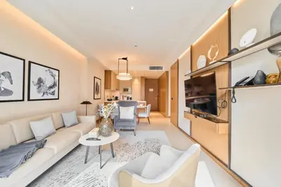 a living room with a couch and a table at Premium 2BR Address Opera Downtown Dubai in Dubai
