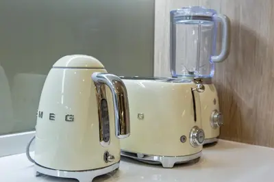 a white toaster sitting on top of a counter at Skyline Escape 2 bedroom with Burj Khalifa View in Dubai
