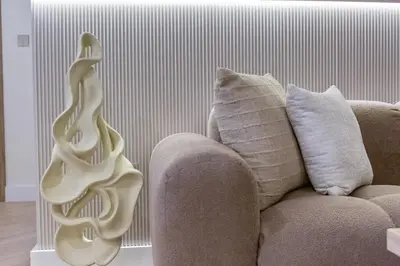a white vase sitting next to a couch at Skyline Escape 2 bedroom with Burj Khalifa View in Dubai