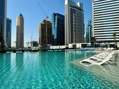 a swimming pool in the middle of a city at Skyline Escape 2 bedroom with Burj Khalifa View in Dubai
