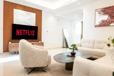 a living room with a netflix sign on the wall at Morden 2BR With Full sea view -High floor in Dubai