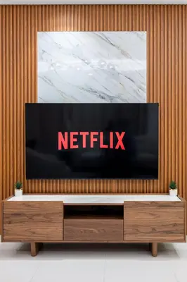 a television sitting on top of a wooden wall at Morden 2BR With Full sea view -High floor in Dubai