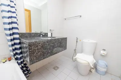 a bathroom with a sink and a toilet at Modern 1BR -Canal Views & Burj Views -Business Bay in Dubai