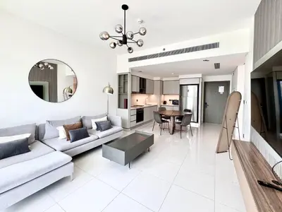 a living room with a couch and a table at Direct Beach Access 2BHK in Dubai