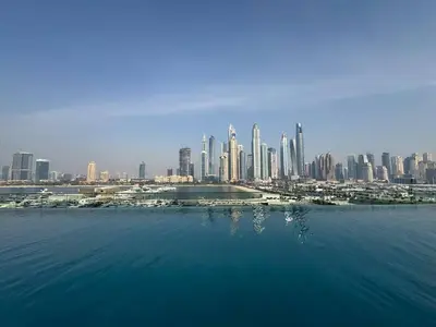 a view of a city from the water with buildings at Direct Beach Access 2BHK in Dubai