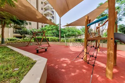 a playground with a slide and a swing at Exclusive 2BR in Rahaal 2, Madinat Jumeirah Living in Dubai