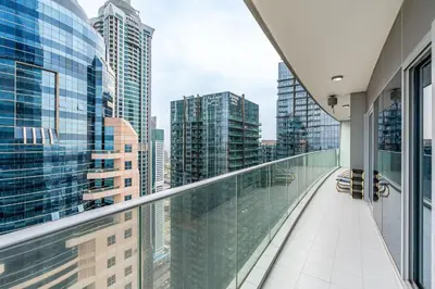 a balcony with a view of a city at Lavish 2-Bedroom Apartment in Dubai Oasis in Dubai
