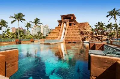 a large pool of water in front of a monument at Beachfront Boho Bliss Direct Beach Access in Dubai