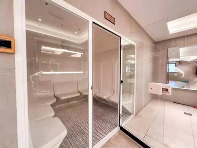 a bathroom with a glass walk in closet at Elite Studio with Burj Khalifa & Pool View in Dubai