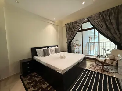 a bedroom with a bed and a large window at Stylish & Fully Furnished 1BR in Laya Residence in Dubai