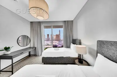 a hotel room with a bed and a window at Vida Residences Dubai Mall - Burj Khalifa View, Downtown Dubai in Dubai